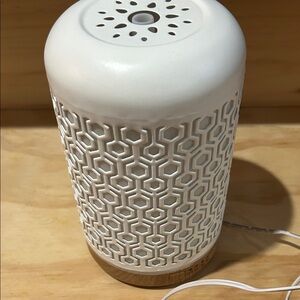 White Ceramic Aromatherapy Diffuser with a bottle of FOCUS essential oil